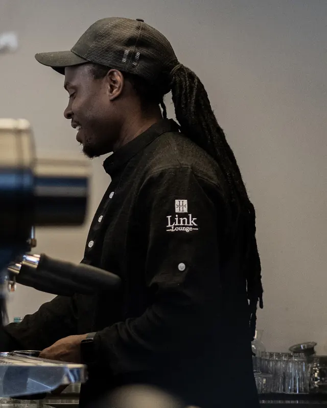 A Link Lounge barista at the espresso machine