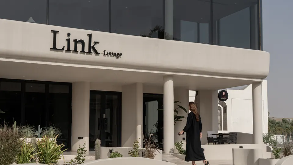The white façade of Link Lounge on Al Ghizlan Street, Al Ain