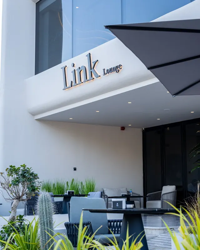The Link Lounge entrance with its curved white canopy
